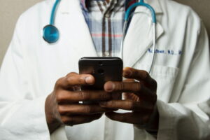 doctor holding mobile phone